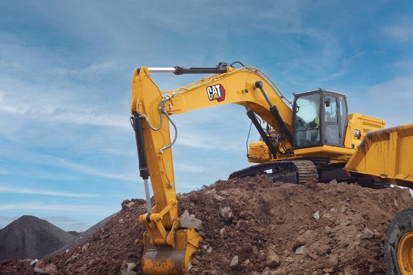 Cat 336 loading haul trucks