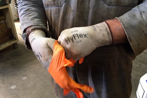 Peterson Technician Donning Layers of Safety Gloves