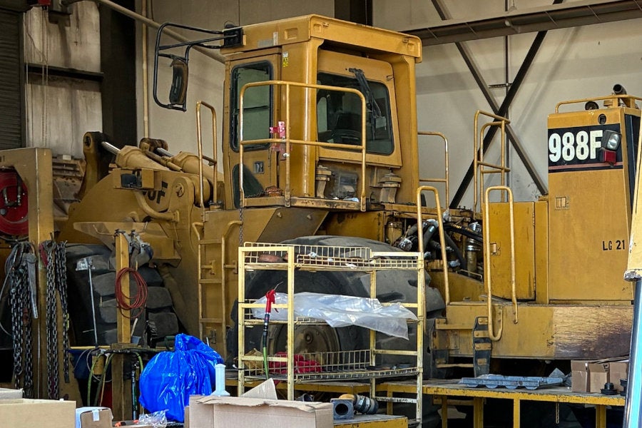 A 988F Wheel Loader partially disassembled for major repairs
