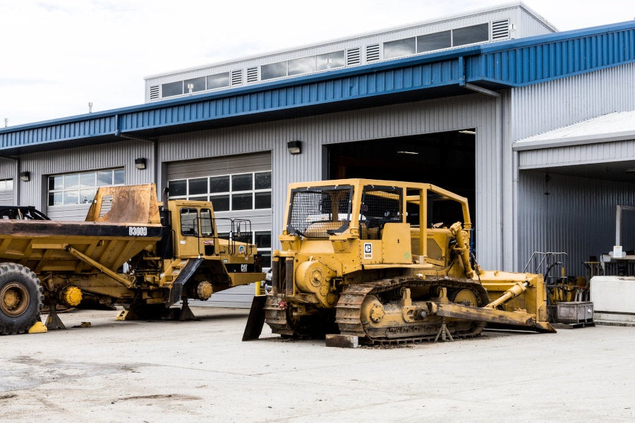 D300D articulated truck and D7G dozer getting serviced