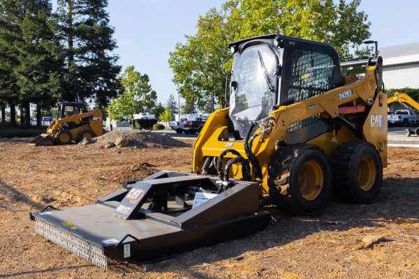 Cat brush cutter mounted on a Cat skid steer loader for sale in San Martin, California