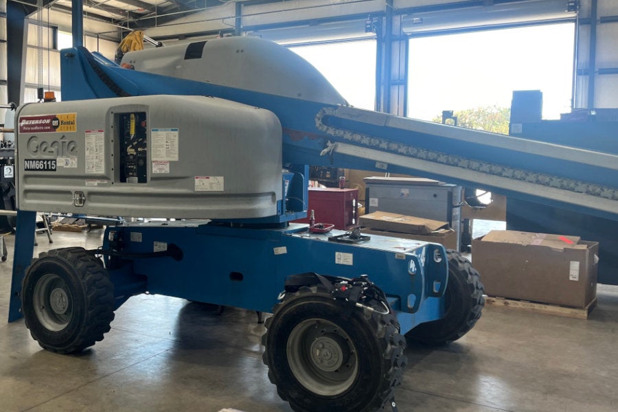 Rental Genie boom lift getting make-ready maintenance between rentals.