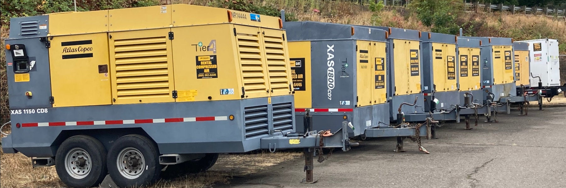 Towable industrial air compressors on the rental-ready line at Peterson Cat Eugene