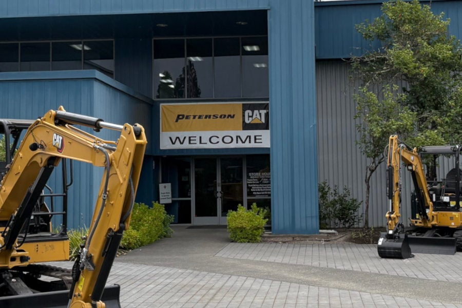 Large welcome banner over the entrance to the Peterson Cat Santa Rosa store