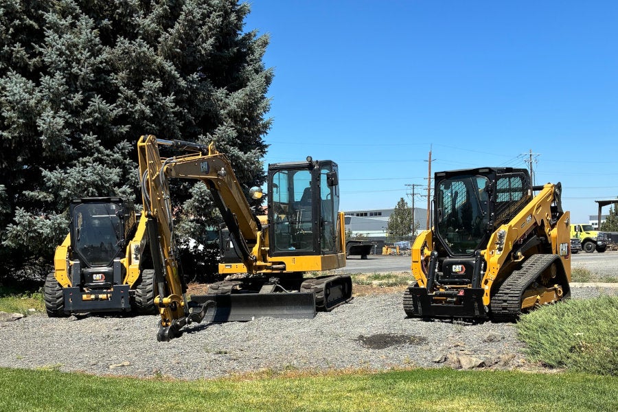 A Next Generation Cat skid steer loader, mini excavator, and compact track loader in an outdoor equipment display