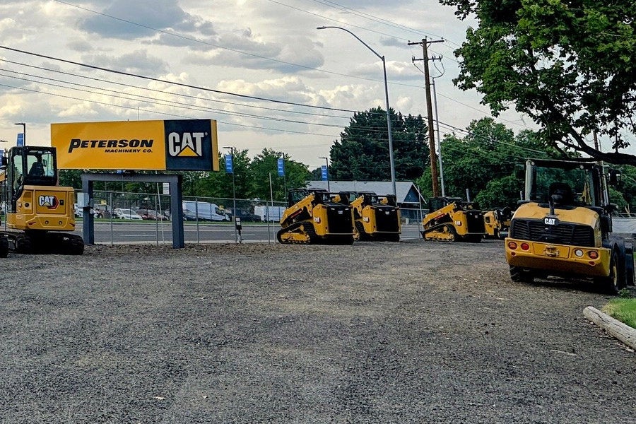 Medford marquee sign with a line of Cat compact track loaders