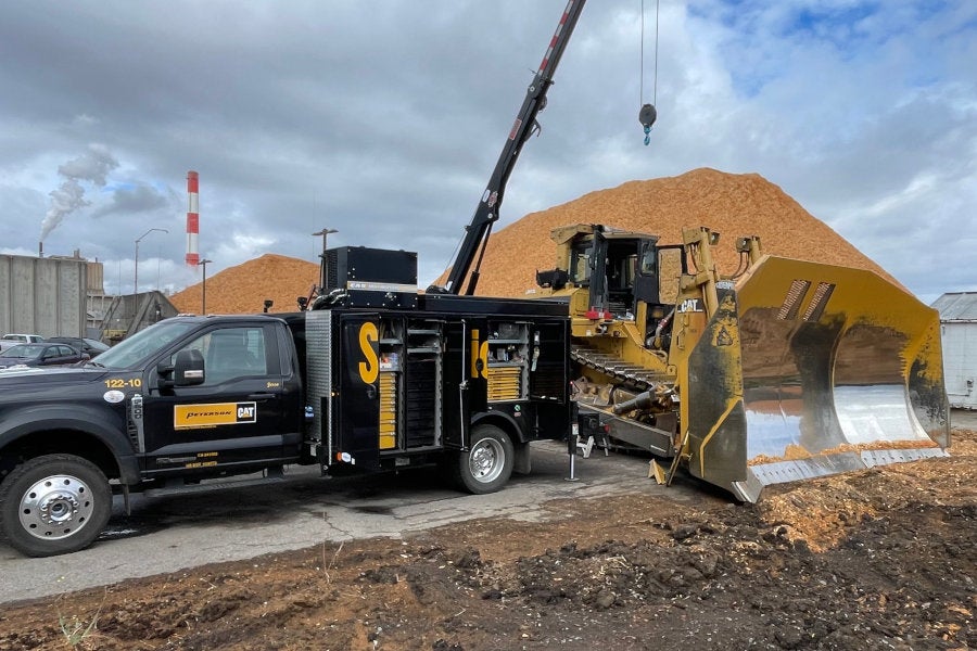 Peterson Cat field service truck servicing a Cat D9T dozer in Linn County, Oregon