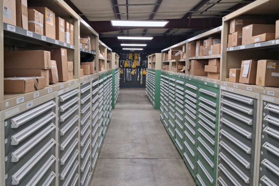 dozens of parts drawers with shelves of parts on top
