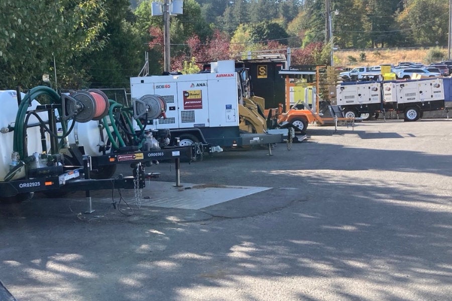 Fire-fighting water trailers,a towable air compressor, and four towable Cat generator sets on the rental-ready line