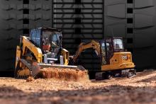 Caterpillar Machines on a background of rubber tracks