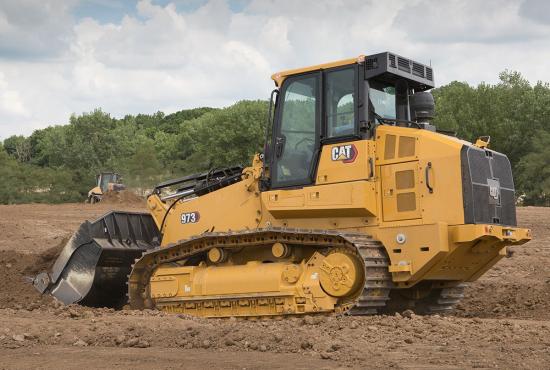 The versatile 973 loader makes easy work of digging a trench