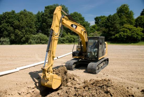 313F Hydraulic Excavator digging a trench