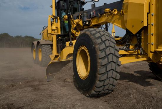 Leveling the ground with the 14 road grader
