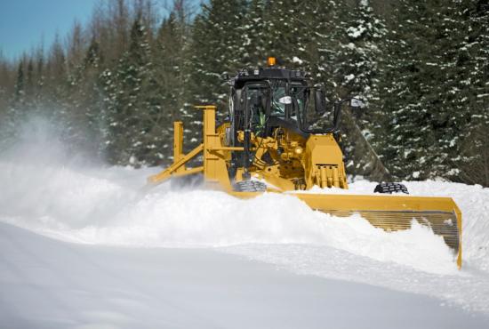 14 motor grader plowing  with snow wing