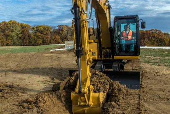 311F L RR Hydraulic Excavator digging a trench