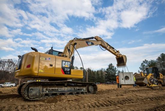 313F GC Hydraulic Excavator lifting concrete