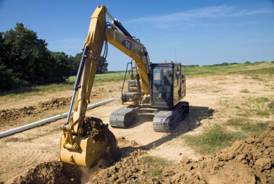 313F Hydraulic Excavator digging a trench