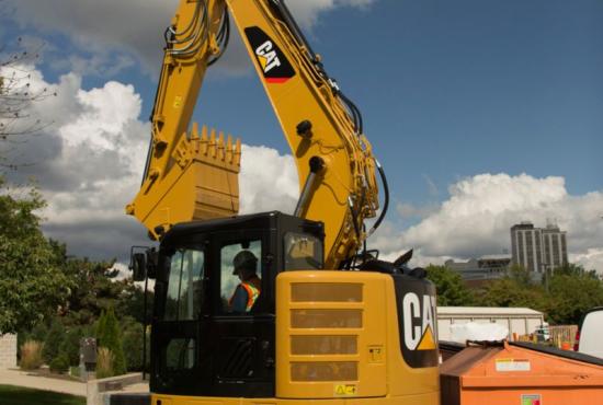 315F L Hydraulic Excavator working near obstacle