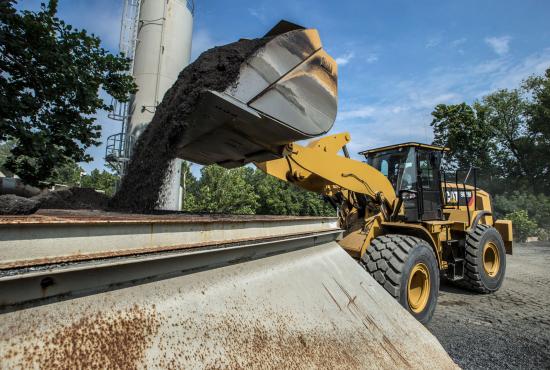 962M Medium Wheel Loader Filling a Belt Conveyor