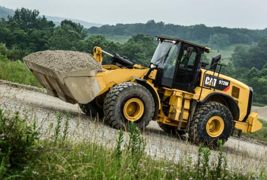 972M XE Medium Wheel Loader Moving a Load of Rock