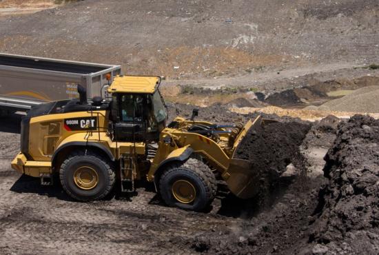 980M Medium Wheel Loader with a Full Bucket