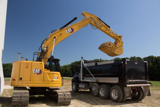 325 Hydraulic Excavator filling a dump truck