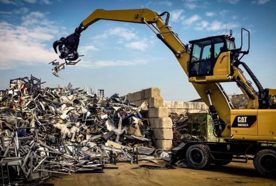 MH3024 Wheel Material Handler Working at a Scrap Metal Recycling Operation