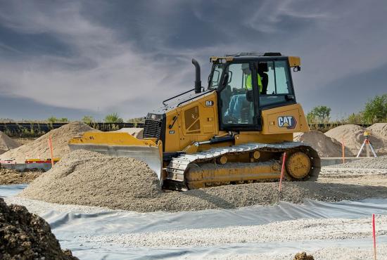 D4 VPAT bulldozer grading in gravel