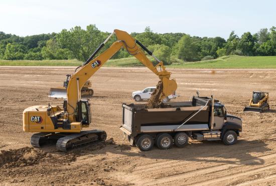 330 GC Hydraulic Excavator loading a dump truck with dirt