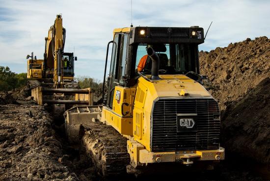 Cat 953 track loader working in a trench