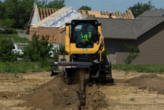 Cat® 259D Compact Track Loader and T9B Trencher Attachment Digging a Trench Cat® 259D Compact Track Loader and T9B Trencher Attachment Digging a Trench