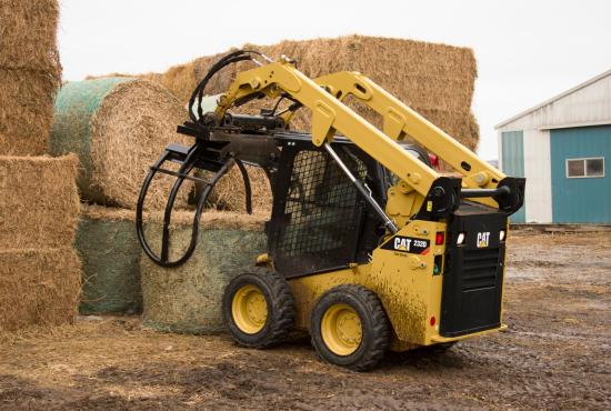 Cat® Bale Grab Picking Up a Wrapped Bale Cat® Bale Grab Picking Up a Wrapped Bale