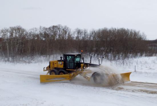 140 Motor Grader plowing with snow wing