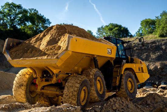725 Articulated Truck Hauling Dirt