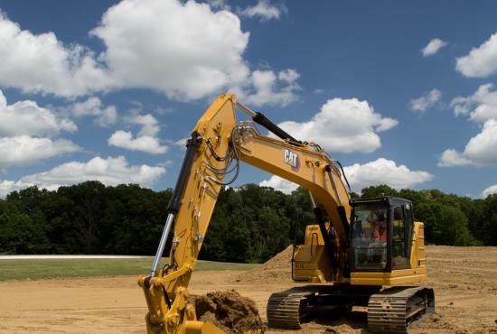 325 Hydraulic Excavator digging a basement
