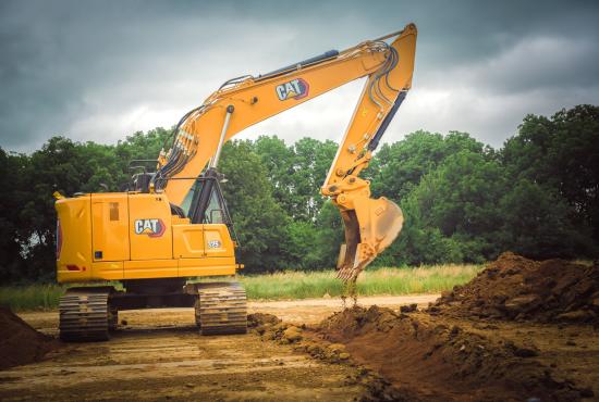 325 Hydraulic Excavator digging a trench