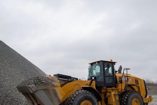 980 GC Wheel Loader with full bucket going to stockpile