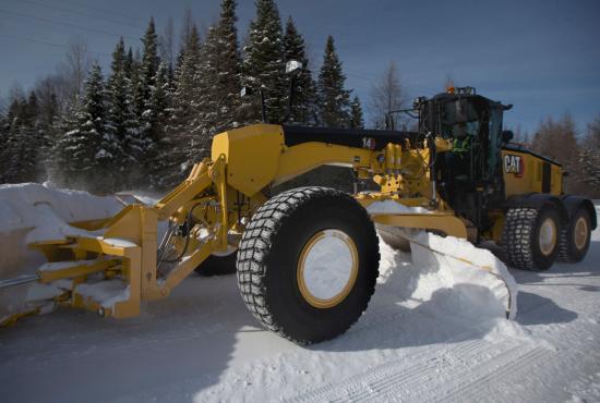 14 Motor Grader pushing snow with snow blade