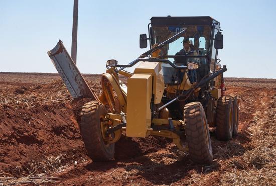 120 Motor Grader working on high bank
