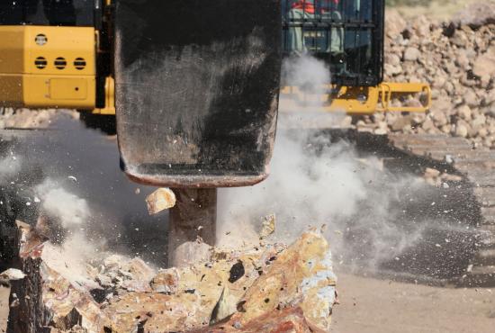 Cat Performance Hammer breaking rock