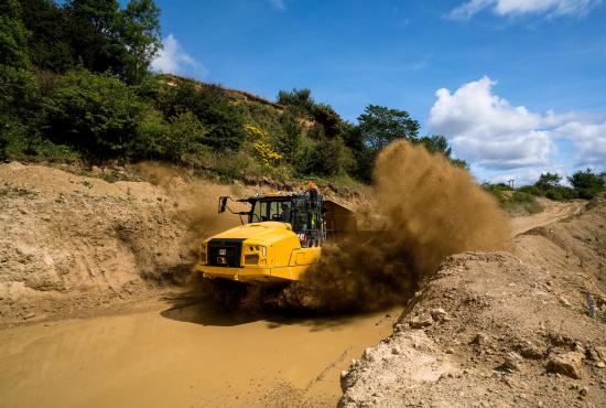 725 Articulated Truck Driving through Mud