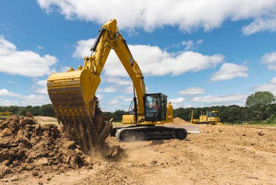 320 Medium Hydraulic Excavator dumping dirt