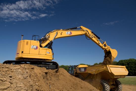 325 Hydraulic Excavator loading dirt into an articulated truck