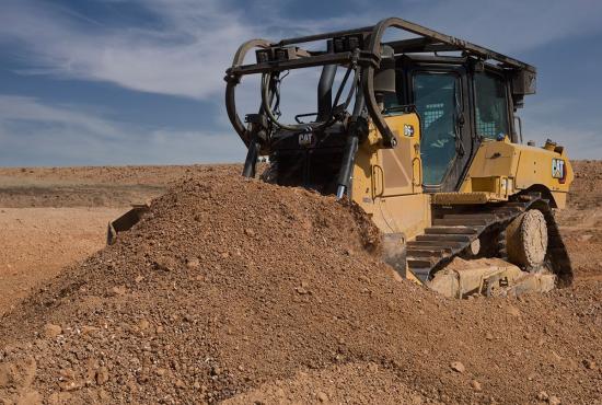 D6 XE Push Arm Bulldozer Working in an Oil Field