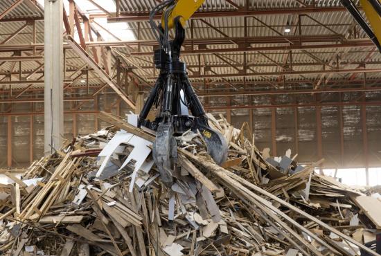 MH3024 picking up from a pile of wood