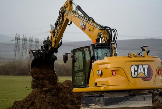 M315 Wheel Excavator digging with a bucket