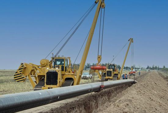 PL83 Pipelayer works in a line to install pipe