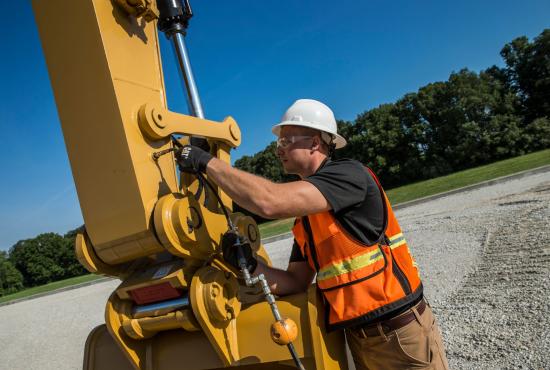 Clearing brush with coupler, rake and thumb.
