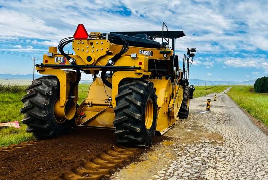 Cat RM500 road reclaimer/soil stabilizer reclaiming an asphalt road