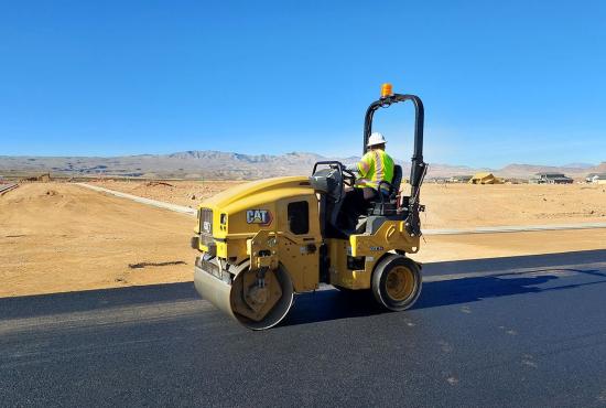 CB2.7 GC combination tandem roller compacting asphalt on a road